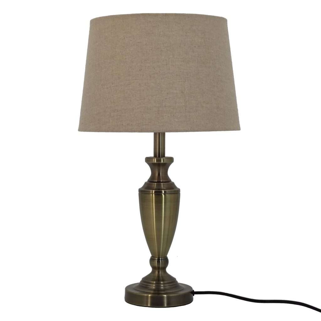 Elegant brass table lamp with beige shade.