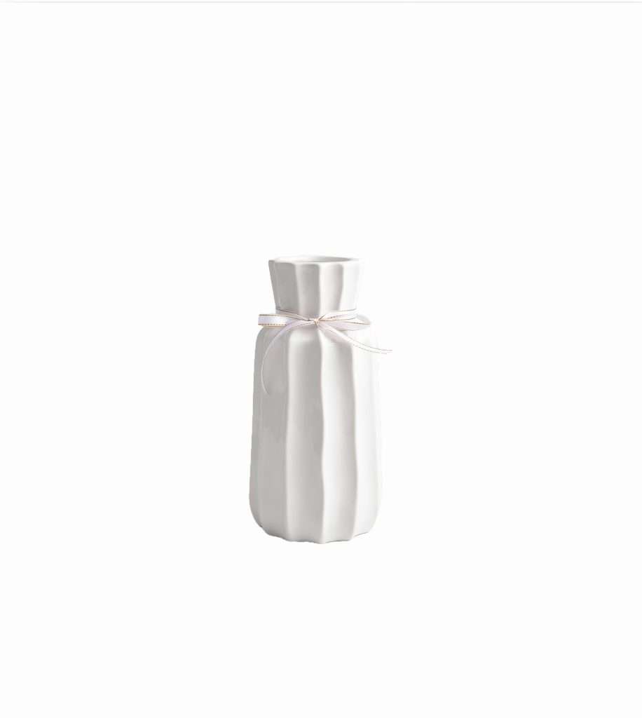 White ceramic vase with ribbon, minimalist design.
