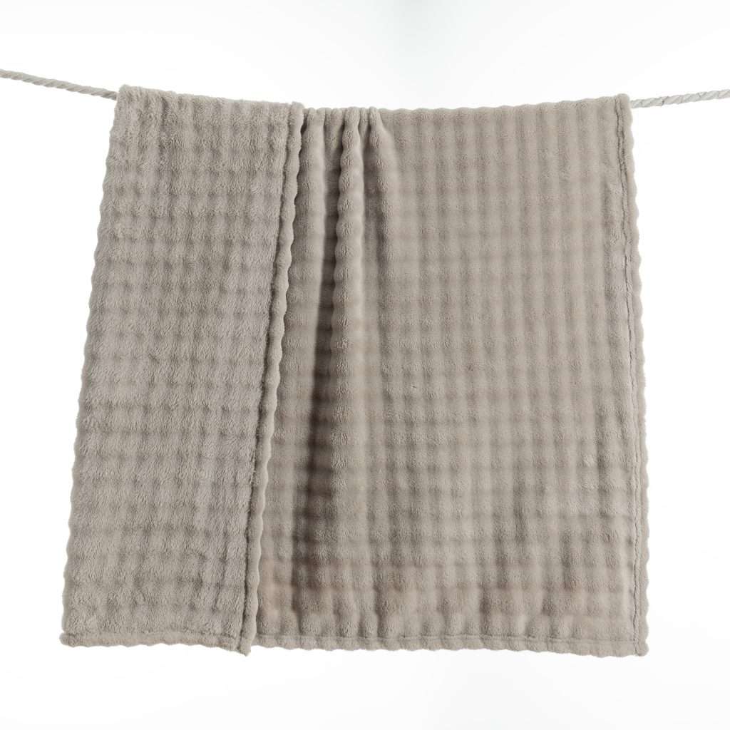 Grey towel hanging on a line