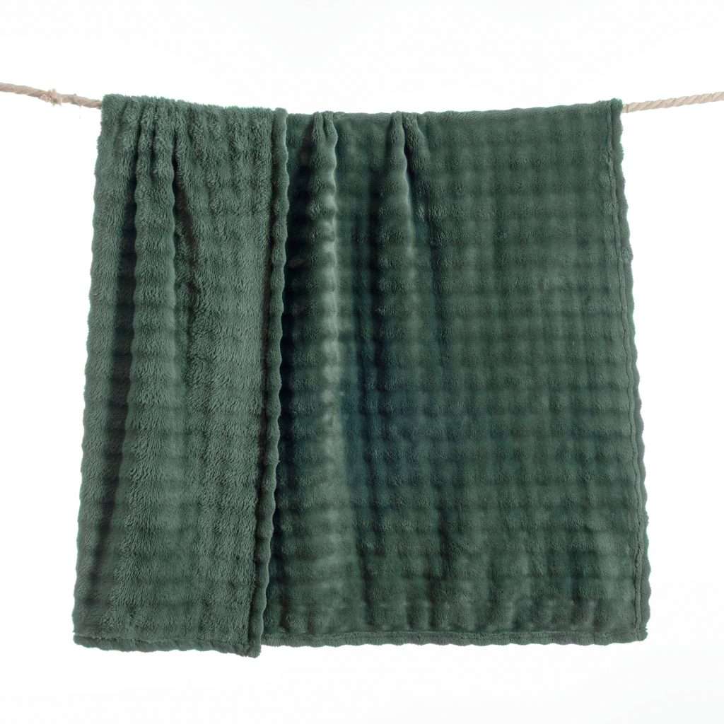 Green towel hanging on a clothesline