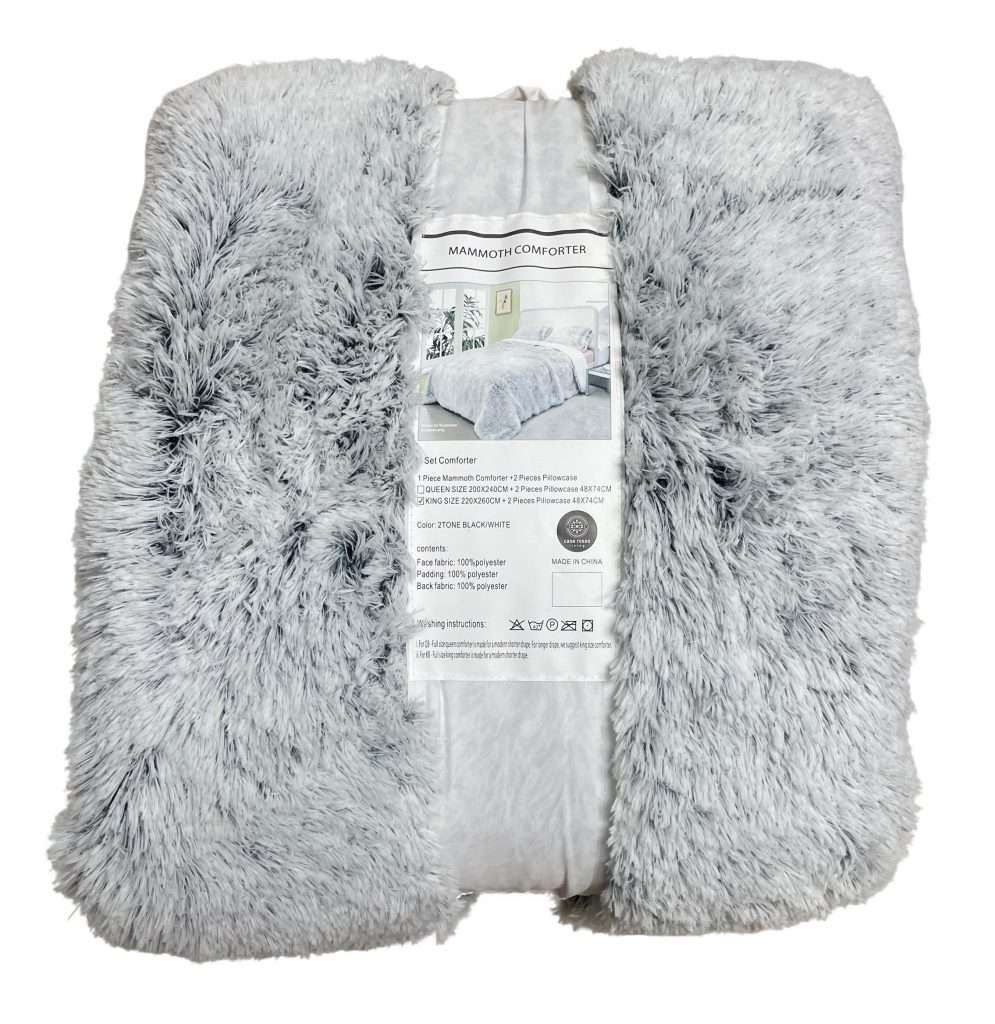 Fluffy grey comforter with packaging label.