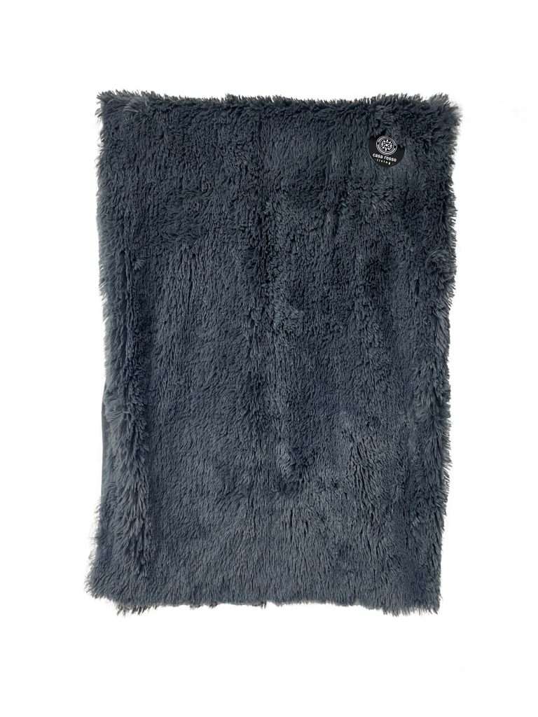 Grey fluffy blanket with label on corner