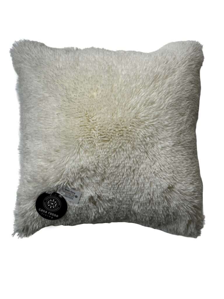 Fluffy white cushion with labels