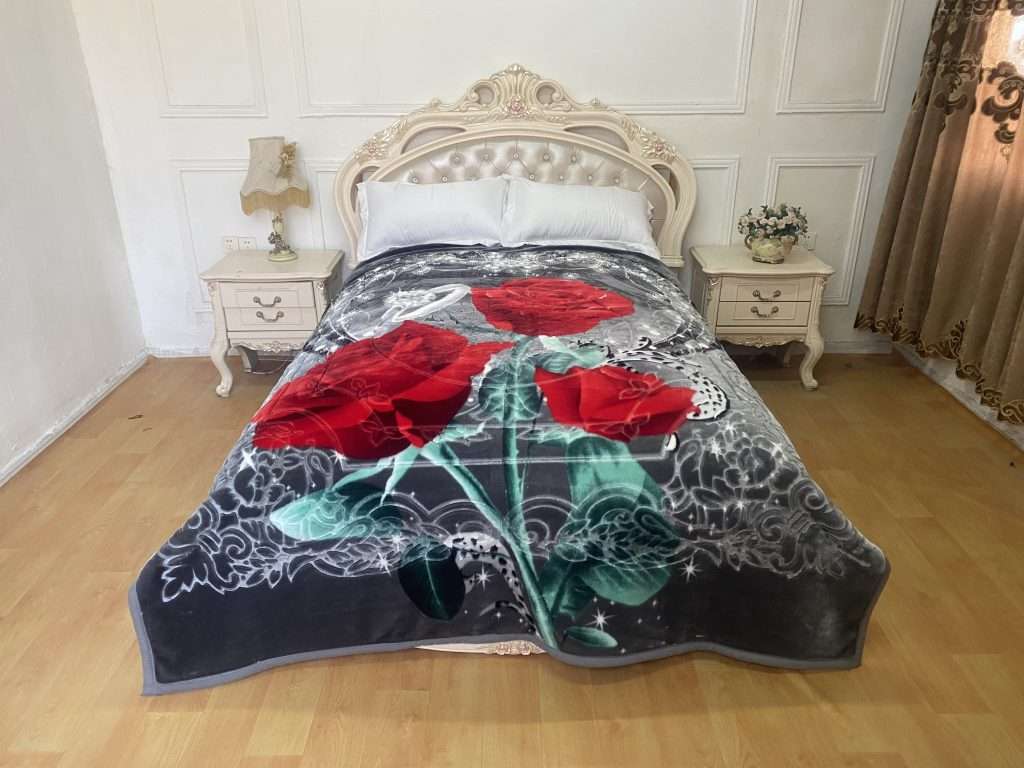Floral blanket on ornate bed