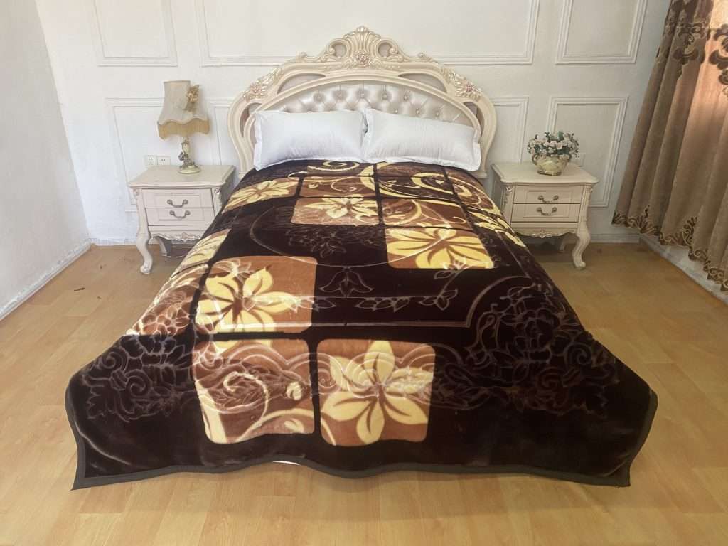 Elegant bedroom with floral-patterned blanket