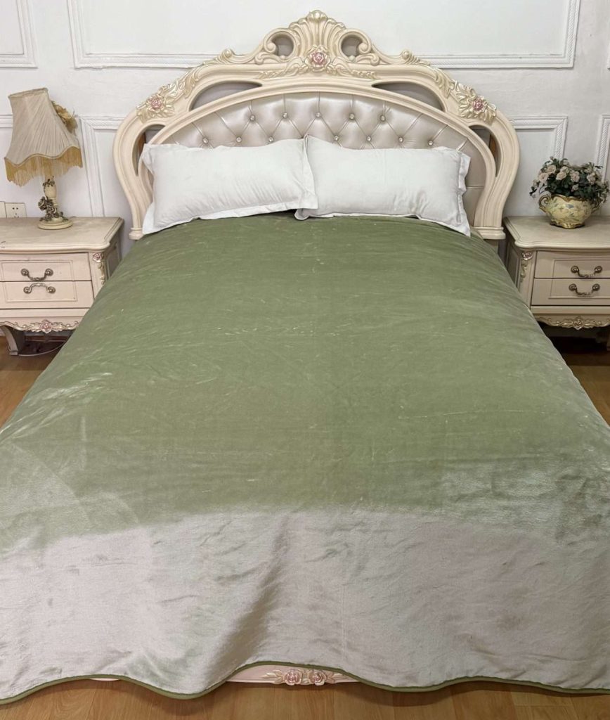 Elegant bedroom with green bedspread