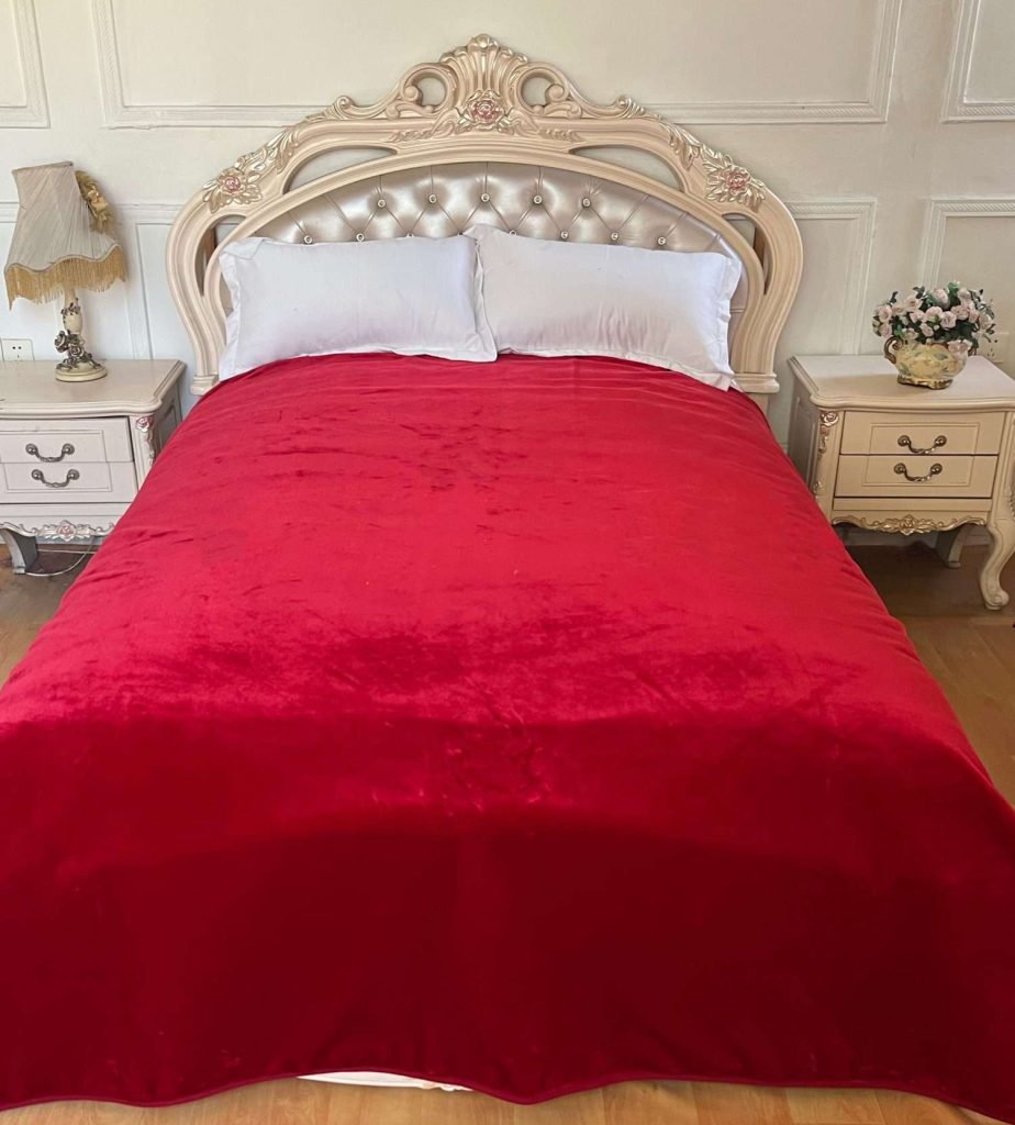 Elegant bedroom with a red bedspread