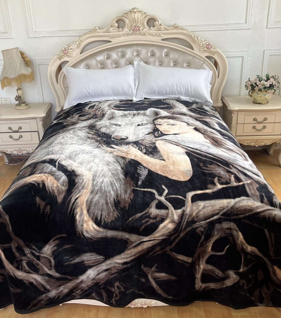 Elegant bed with artistic blanket design