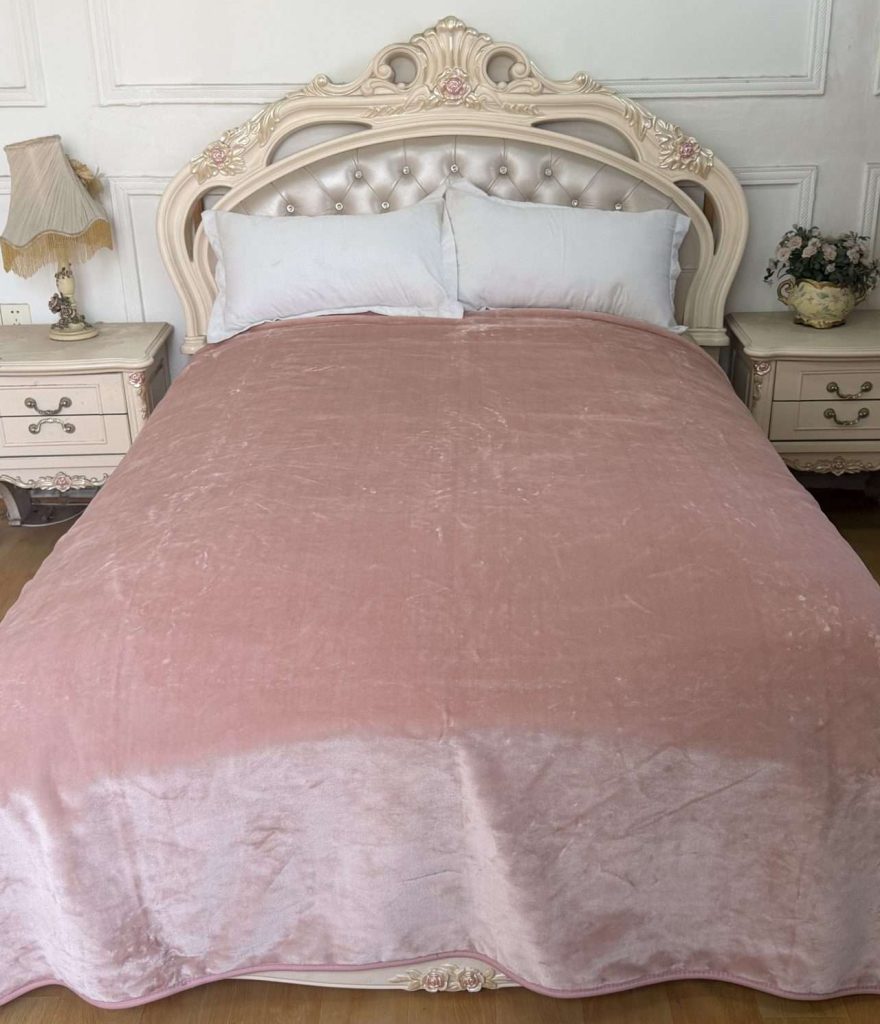 Elegant bedroom with pink velvet bedding