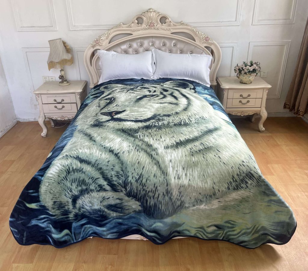 Ornate bed with white tiger blanket