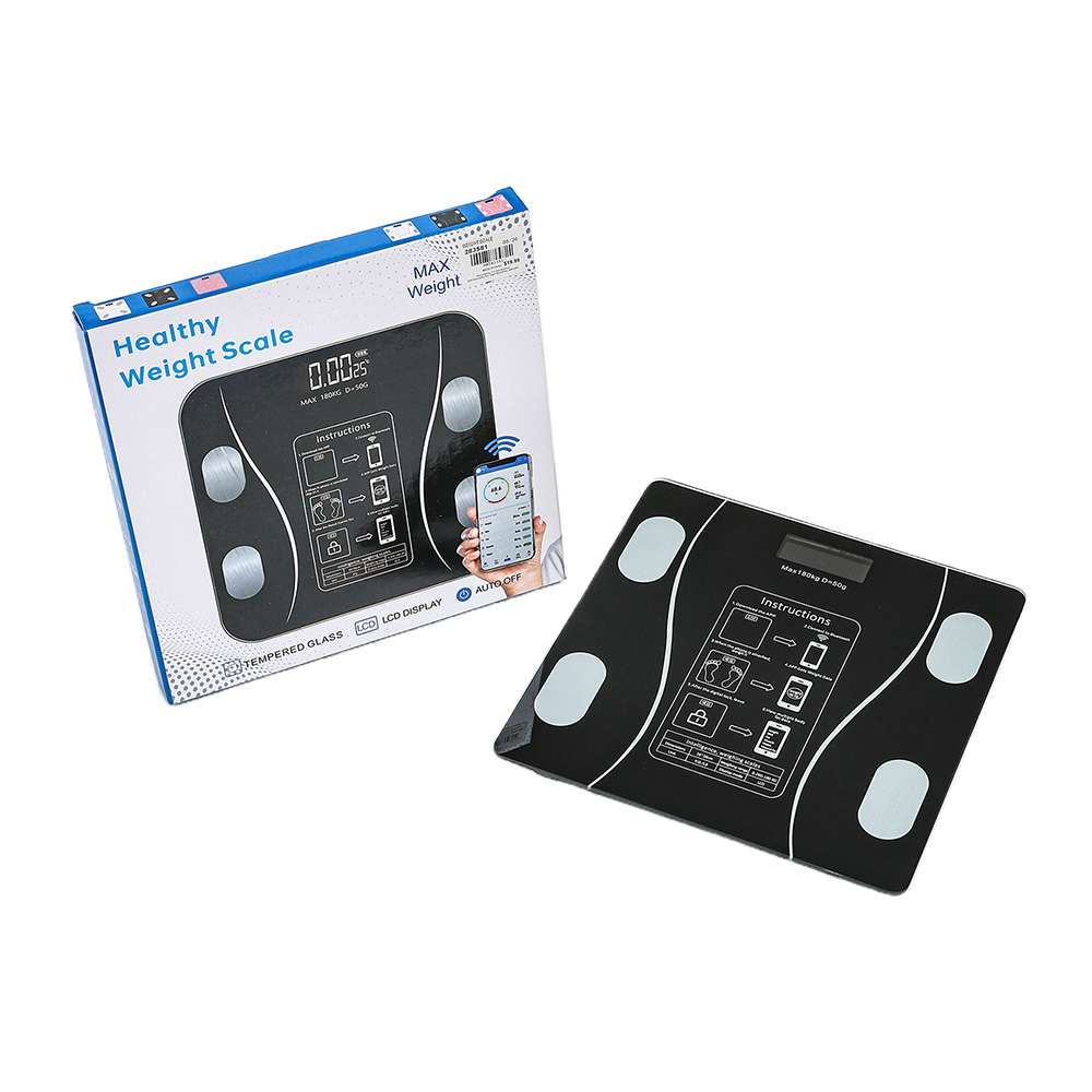Black digital body-weight scale beside retail packaging