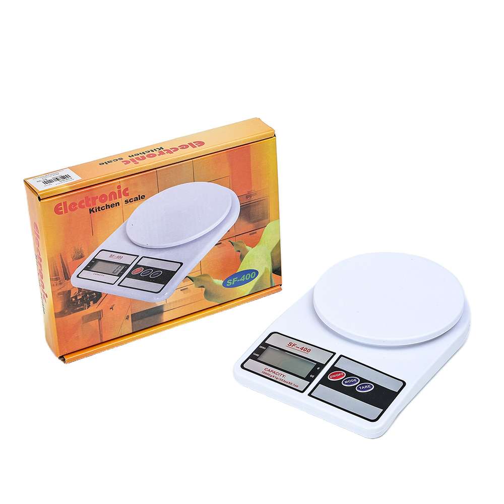 White electronic kitchen scale beside its orange retail box